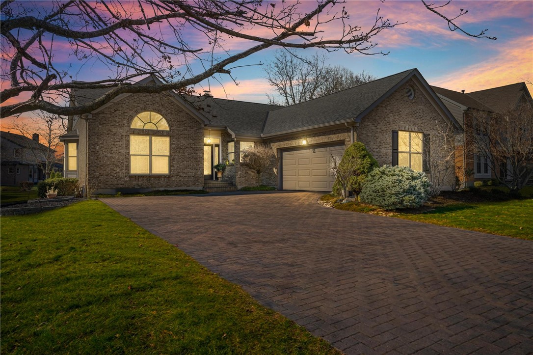 8781 Rupp Farm Drive West Chester, OH 45069 - Photo 1 of 48 This exquisite home boasts a brick exterior, an arched window, and an attached garage with a paved driveway.