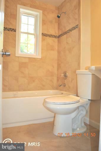 2904 Harris Avenue Silver Spring, MD 20902 - Photo 11 of 17 a bathroom with a toilet a sink and a bathtub