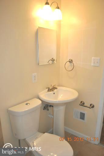 2904 Harris Avenue Silver Spring, MD 20902 - Photo 12 of 17 a bathroom with a sink and mirror
