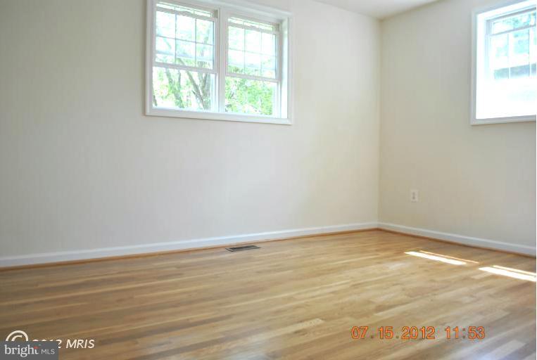 2904 Harris Avenue Silver Spring, MD 20902 - Photo 8 of 17 an empty room with wooden floor and windows