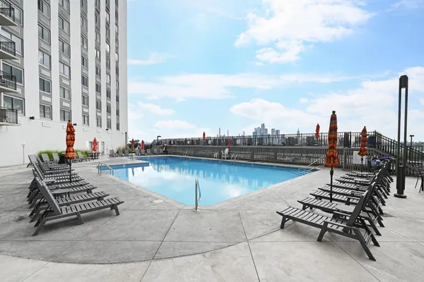 a view of swimming pool with outdoor seating