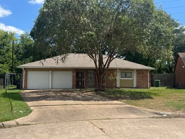 a front view of a house with a garage