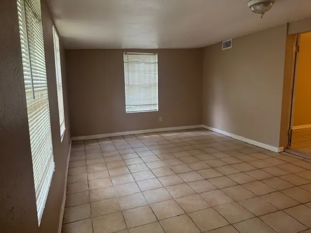 an empty room with windows