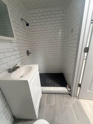 a bathroom with a sink and a shower