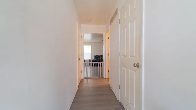 a view of a hallway with a white walls