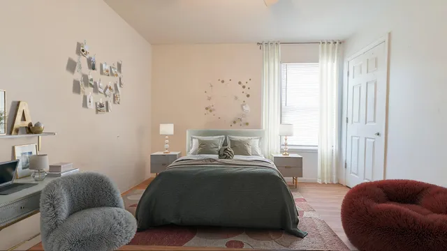 a bedroom with bed couch and window