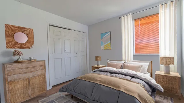 a bedroom with a bed and a dresser