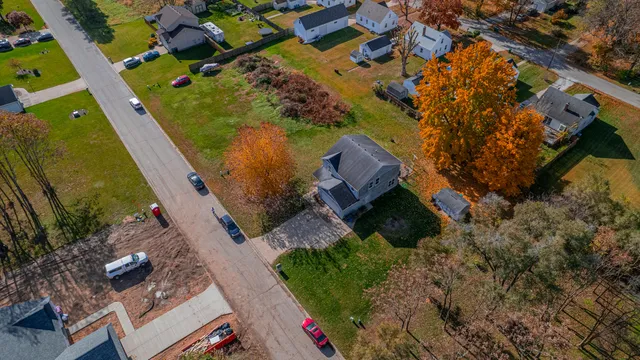 an aerial view of a house with outdoor space