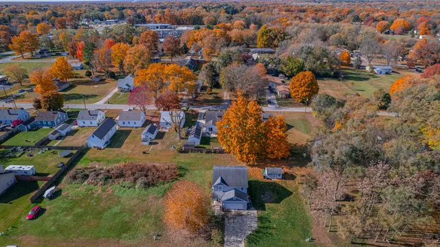 an aerial view of residential houses with outdoor space