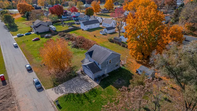 an aerial view of a house with a garden