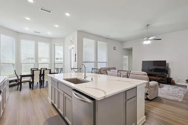 a view of living room filled with furniture and wooden floor