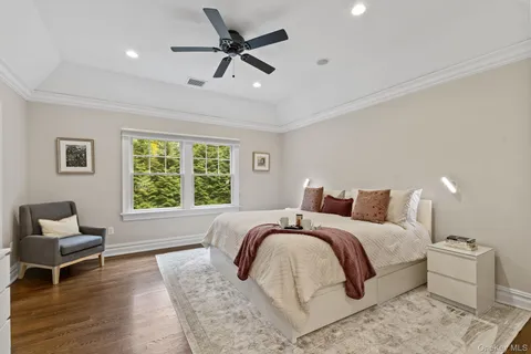 a spacious bedroom with a large bed and a window