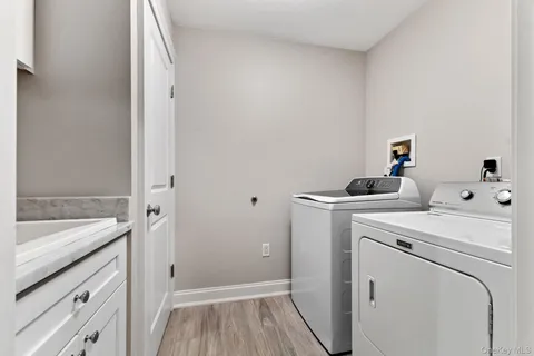 a view of storage and utility room with washer and dryer