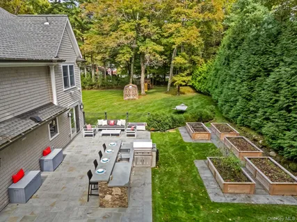 a view of yard with patio