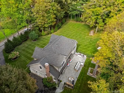 an aerial view of a house with a garden