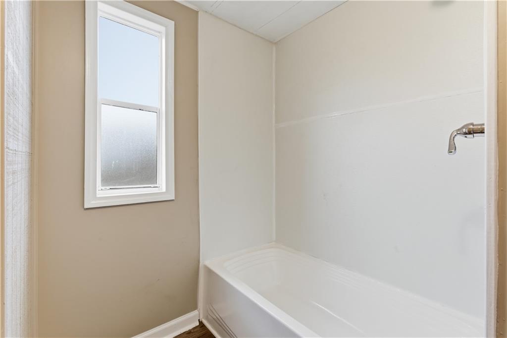 50 Tency Lane Northeast Rome, GA 30165 - Photo 15 of 28 a white bath tub sitting next to a window