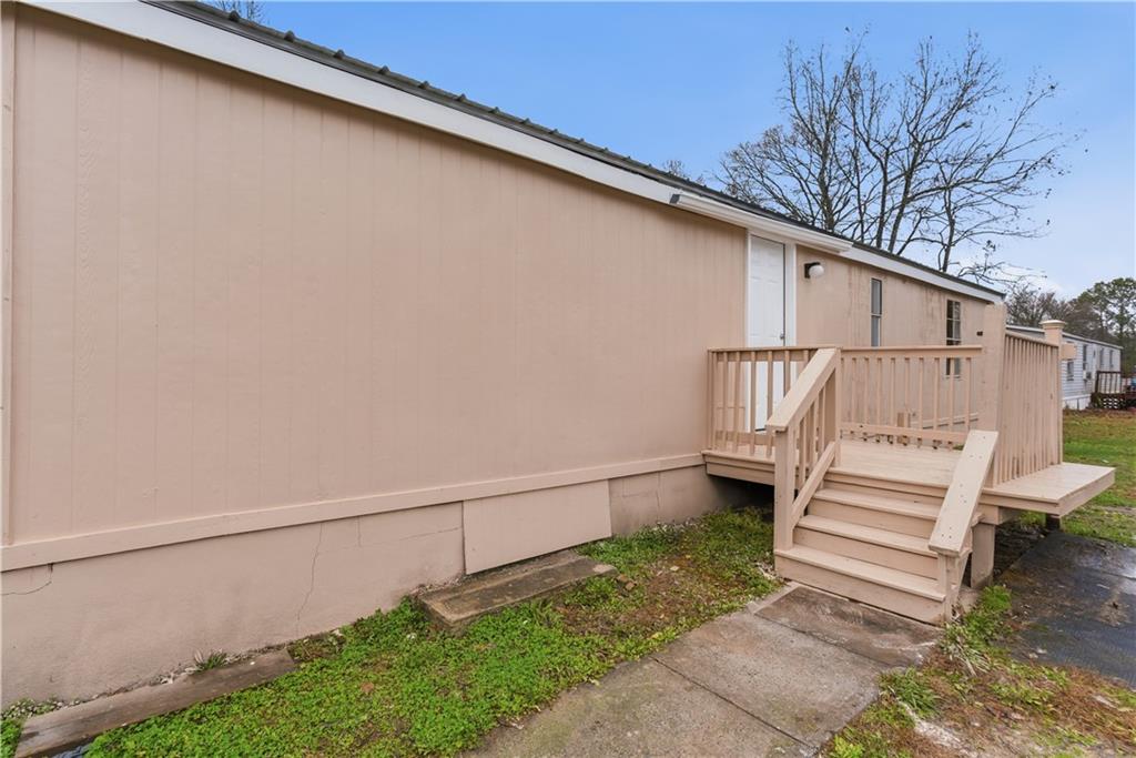 50 Tency Lane Northeast Rome, GA 30165 - Photo 23 of 28 a view of a back yard with a white house
