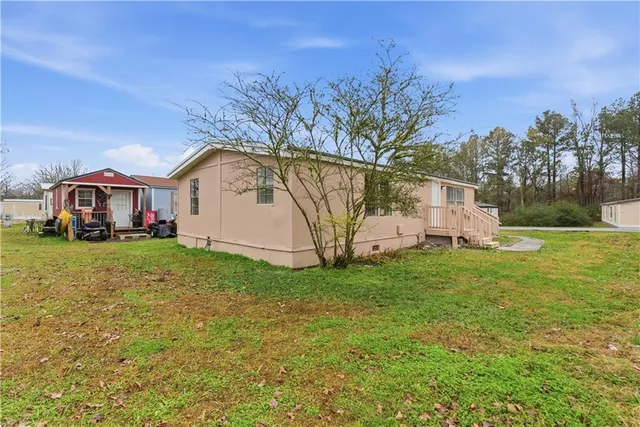 a front view of house with garden