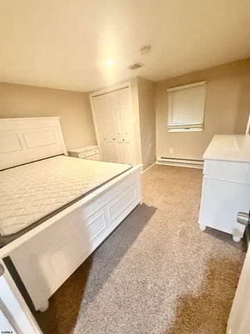 a spacious bathroom with a sink and a mirror