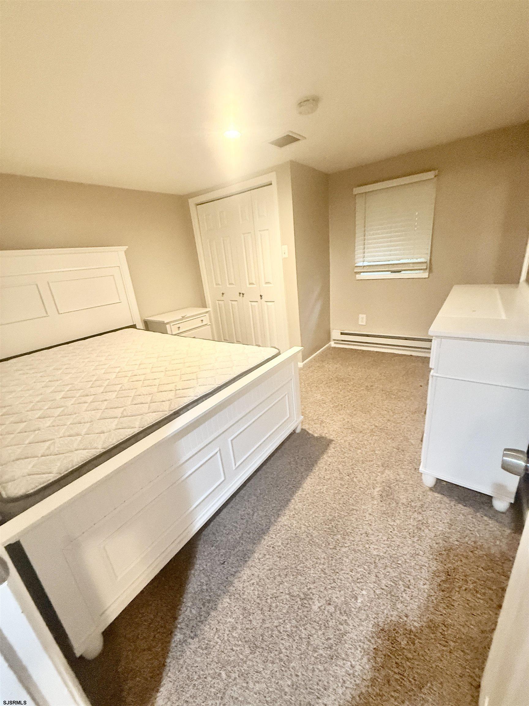 752 7th Street, Unit B Somers Point, NJ 08244 - Photo 9 of 10 a spacious bathroom with a sink and a mirror