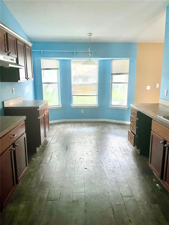 2 Redwood Track Run Ocala, FL 34472 - Photo 3 of 13 a view of a kitchen with a sink dishwasher and a fireplace