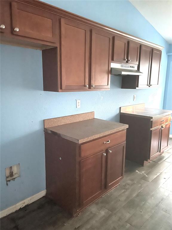 2 Redwood Track Run Ocala, FL 34472 - Photo 4 of 13 a kitchen with stainless steel appliances a stove a microwave and white cabinets