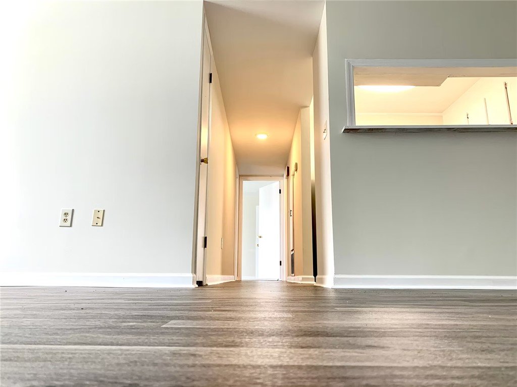 4115 Liberty Highway Anderson, SC 29621 - Photo 31 of 34 Typical Downstairs Vinyl Floor Covering Unit Great Room and Hall