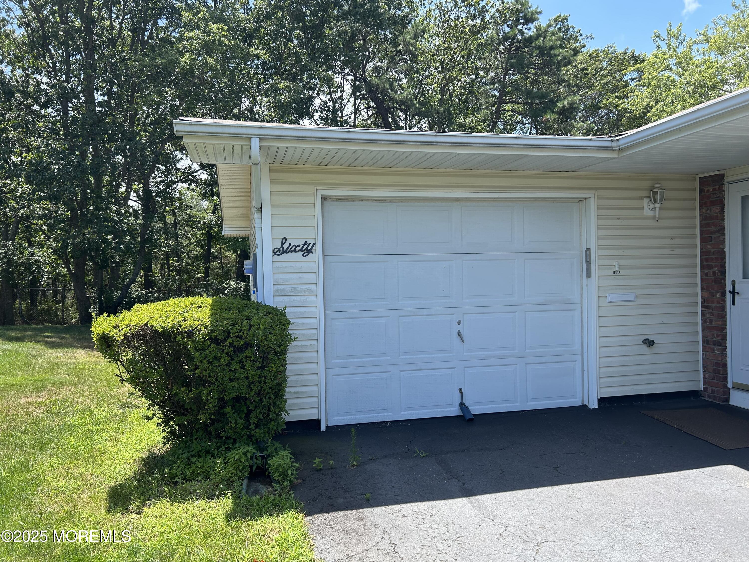60 Central Boulevard Brick, NJ 08724 - Photo 17 of 22 a front view of a house with a garden