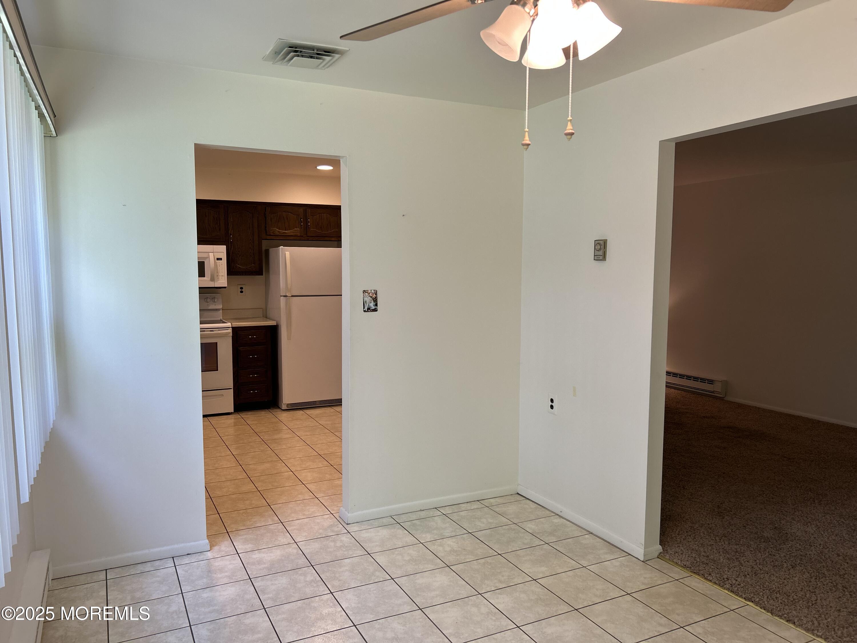 60 Central Boulevard Brick, NJ 08724 - Photo 6 of 22 an empty room and kitchen view with a sink