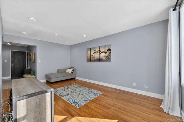 a view of livingroom with hardwood floor and bathroom