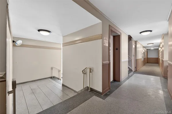 a view of a hallway with staircase