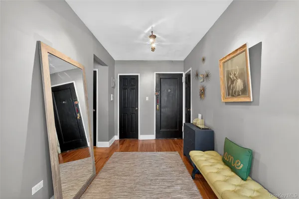 a hallway with furniture and a rug
