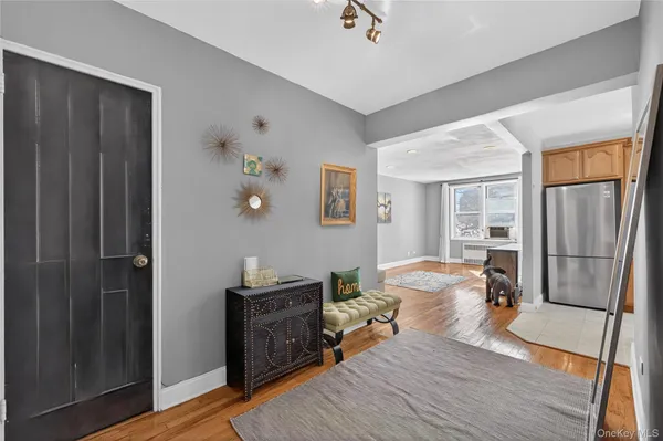 a bedroom with furniture and a wooden floor