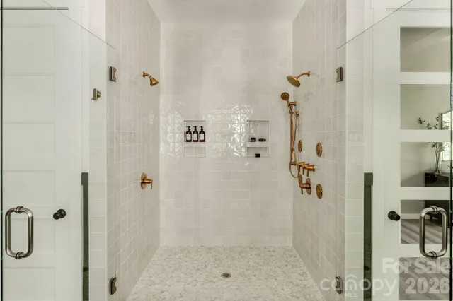 a bathroom with a bathtub and shower