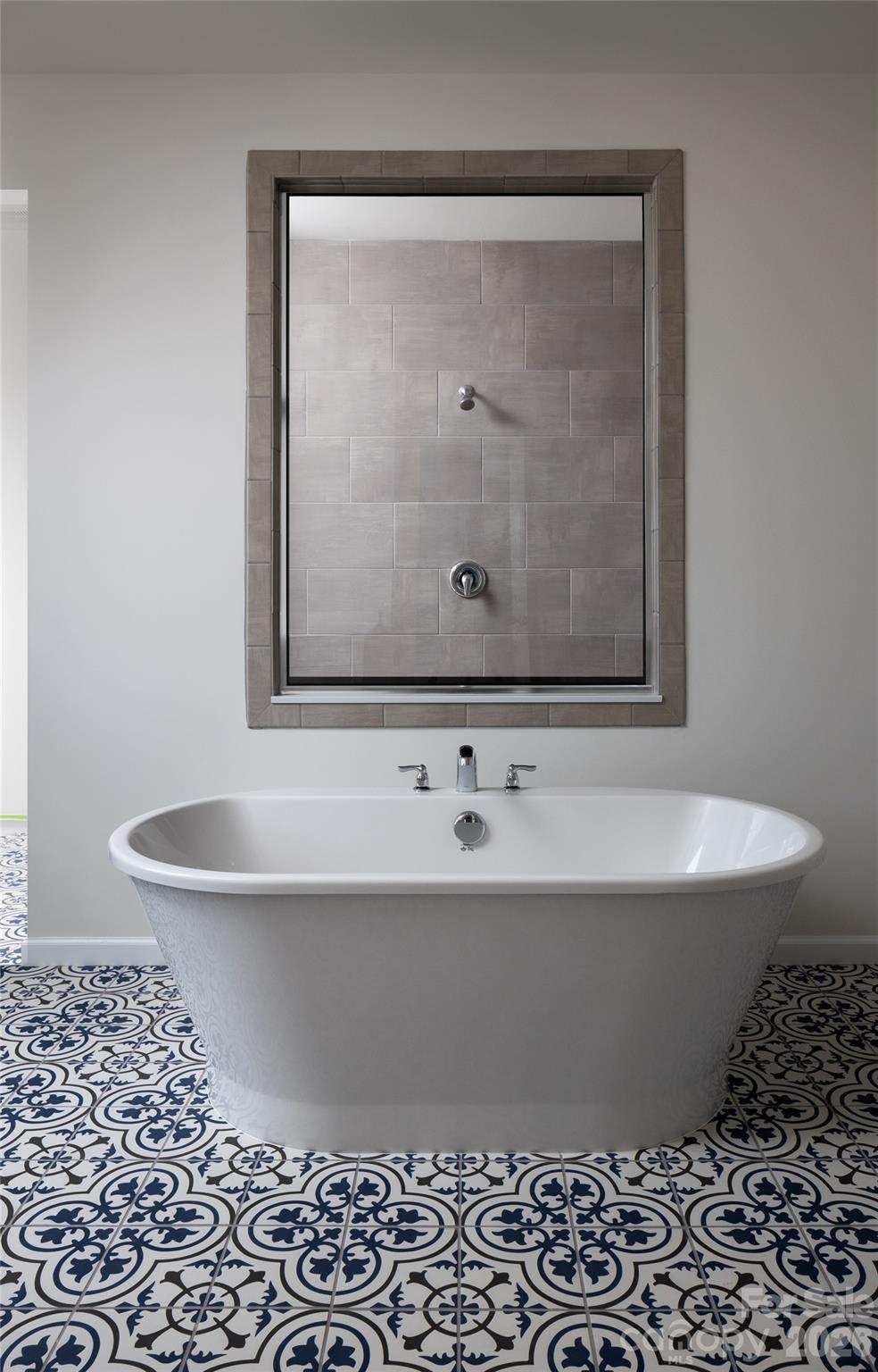 200 Ervin Road, Unit NOTTINGHAM Mooresville, NC 28117 - Photo 29 of 33 a white bath tub sitting in a bathroom