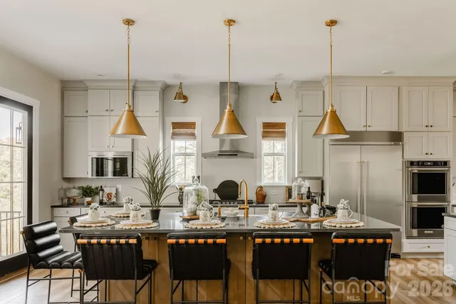 a dining table chairs and a wooden floor