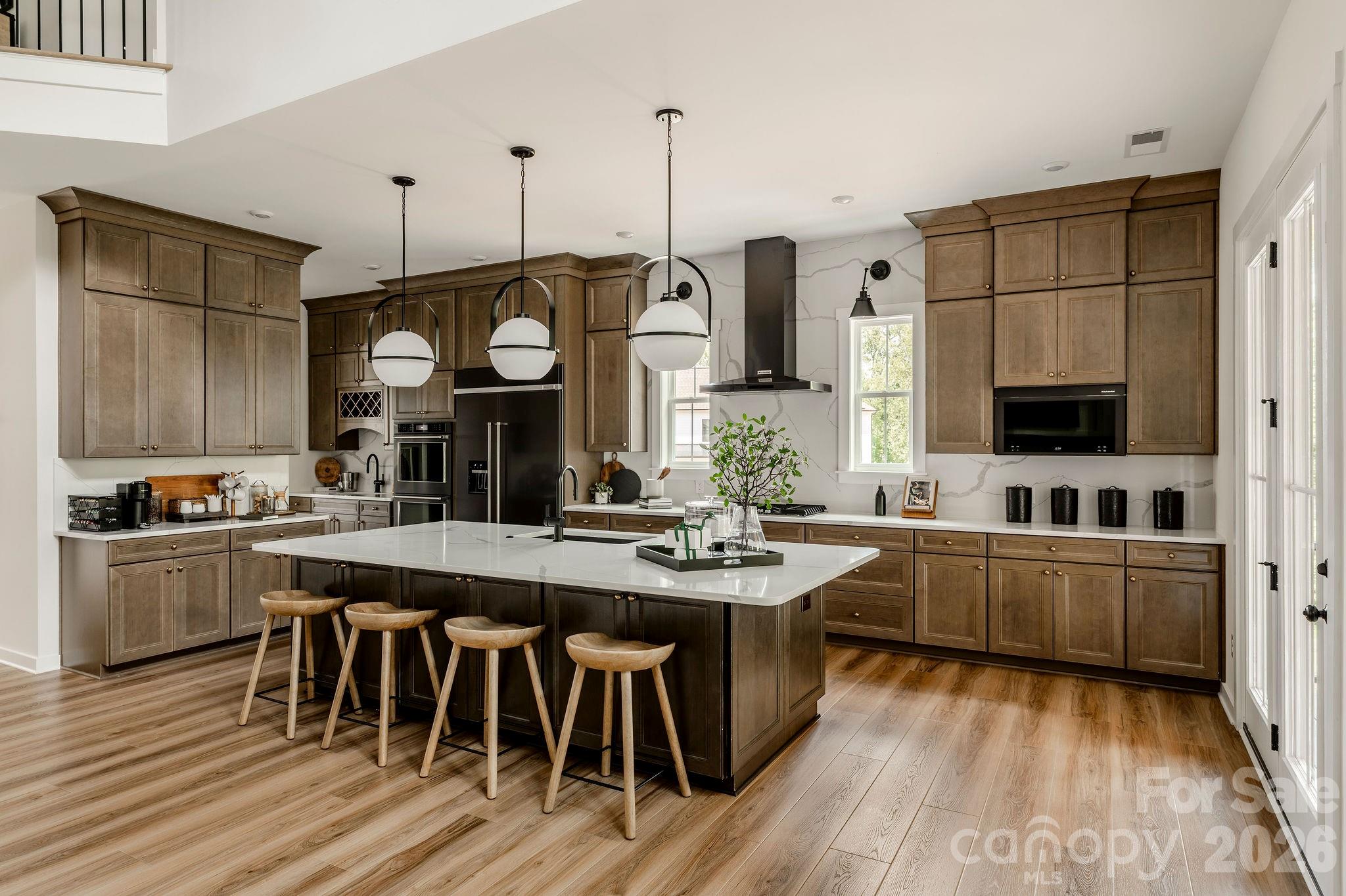 200 Ervin Road, Unit NOTTINGHAM Mooresville, NC 28117 - Photo 8 of 33 a kitchen with stainless steel appliances granite countertop a stove and cabinets
