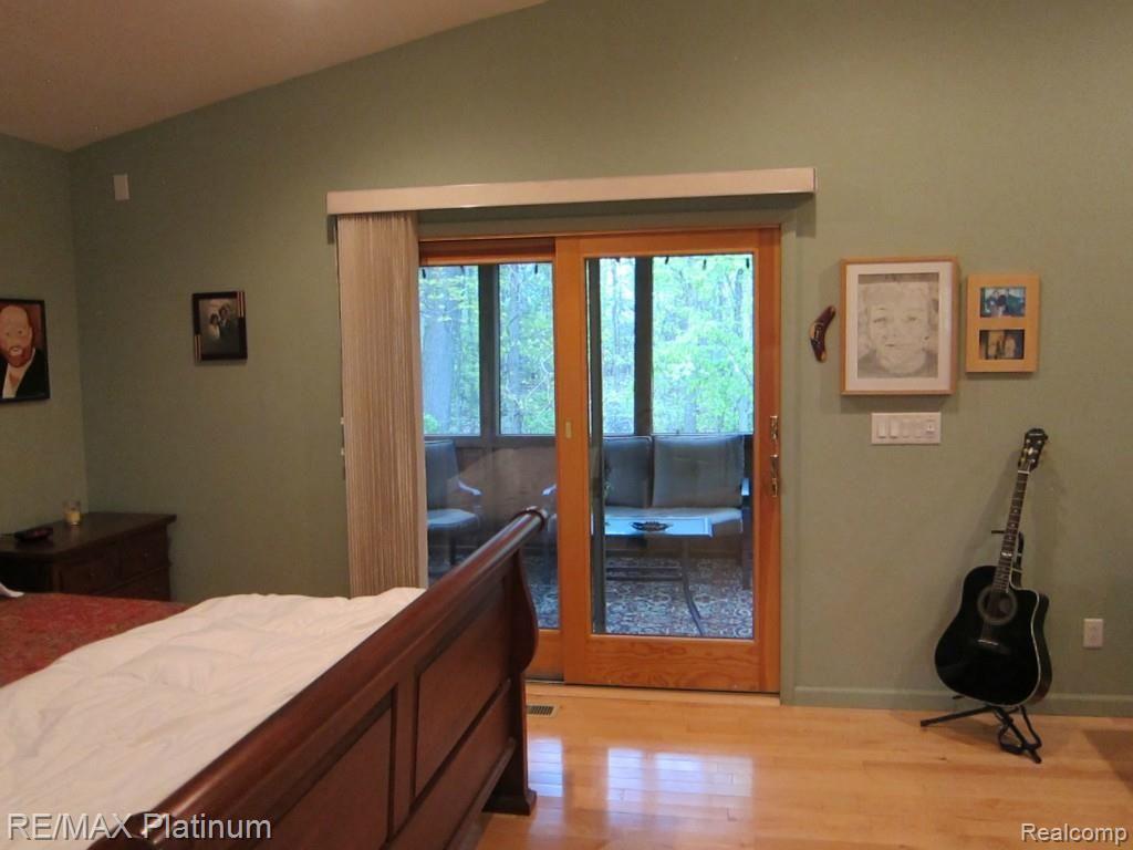 6480 Mack Road Howell, MI 48855 - Photo 17 of 27 Master Suite showing doorwall to screened porch.