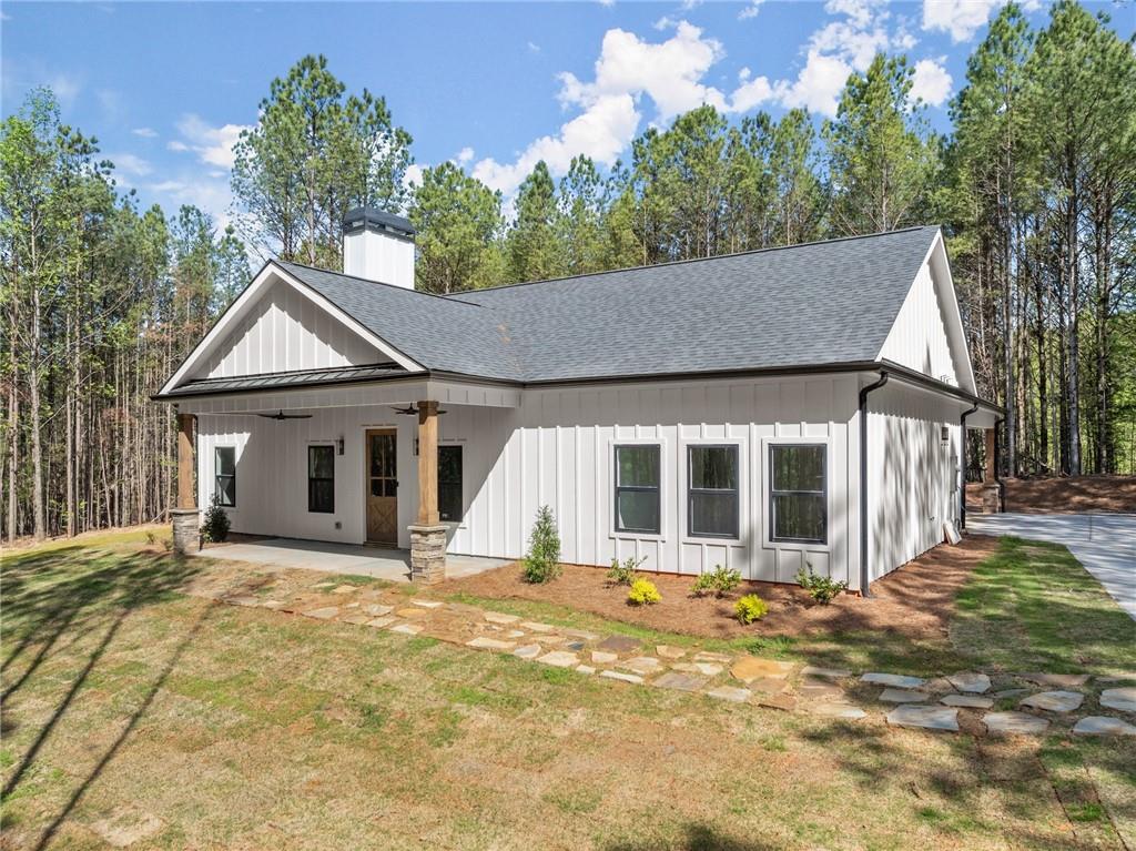 0 Arthur Allen Road Cleveland, GA 30528 - Photo 18 of 22 a front view of a house with a garden and yard