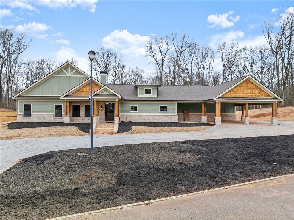 0 Arthur Allen Road Cleveland, GA 30528 - Photo 10 of 22 a front view of a house with garden