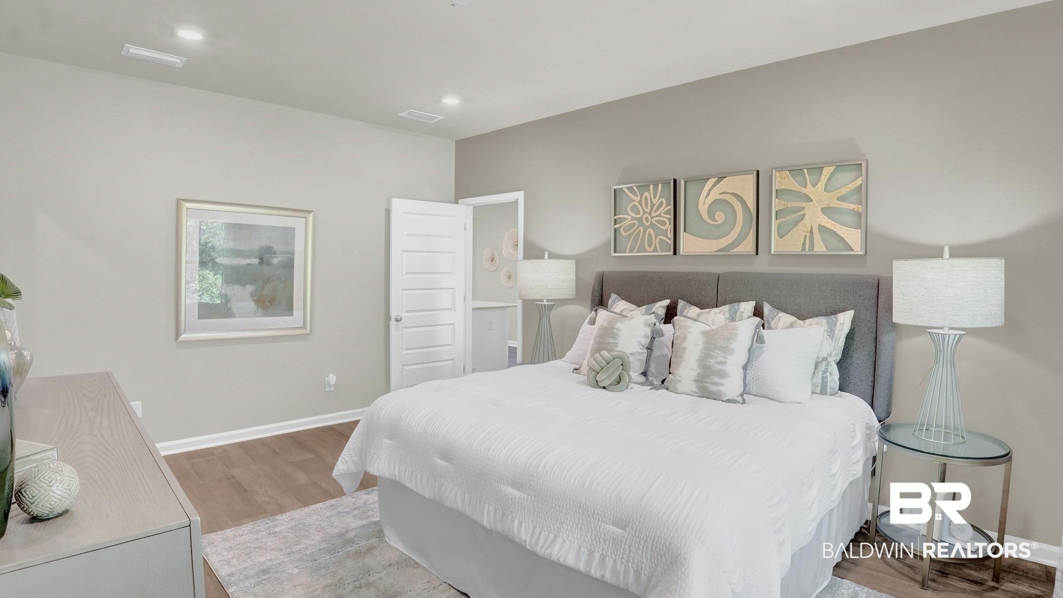 13330 Shea Circle Foley, AL 36535 - Photo 12 of 15 Bedroom featuring wood-finish flooring, light grey wall paint, and white baseboards
