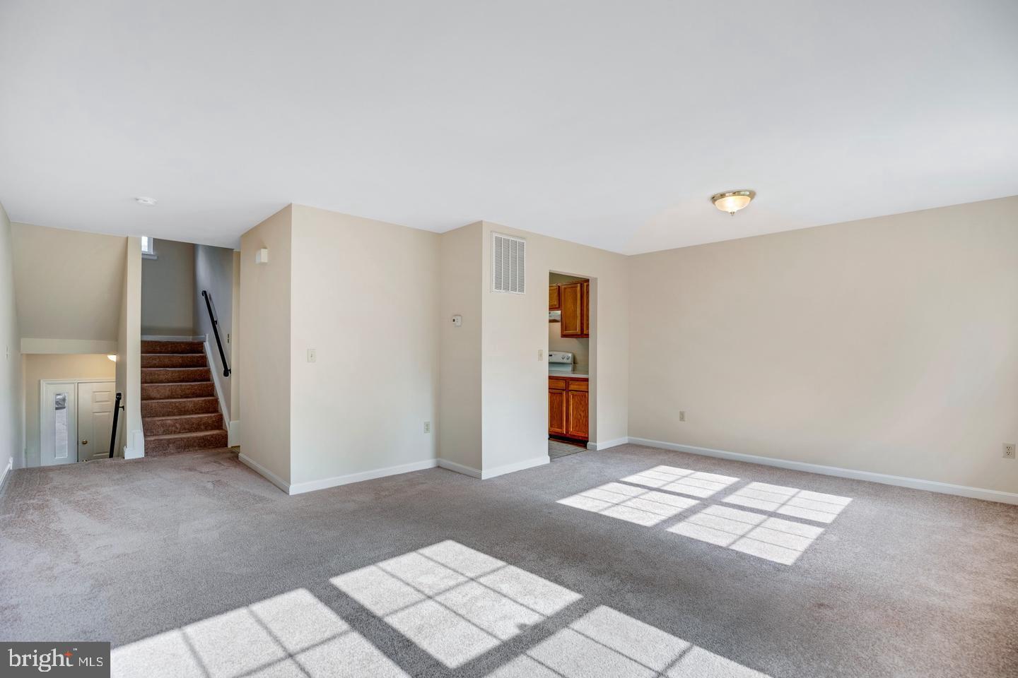 8549 E Street Chesapeake Beach, MD 20732 - Photo 2 of 10 a view of entryway with stairs and a window