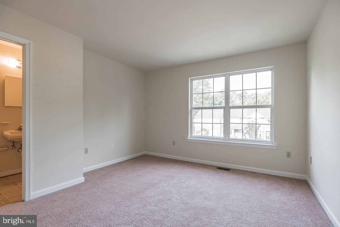 8549 E Street Chesapeake Beach, MD 20732 - Photo 8 of 10 an empty room with a window