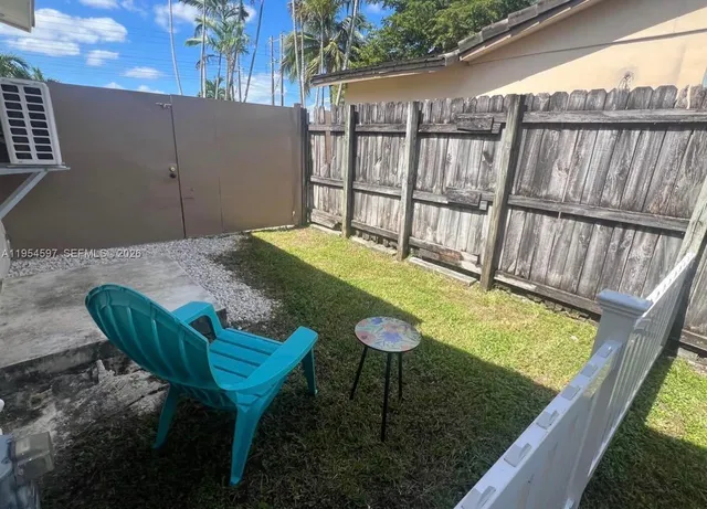 a view of a backyard with plants