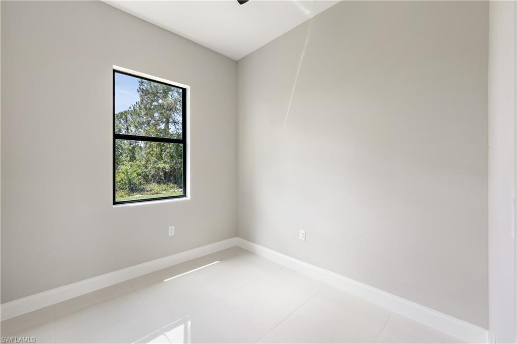 2903 37th Street West Lehigh Acres, FL 33971 - Photo 11 of 23 an empty room with a window