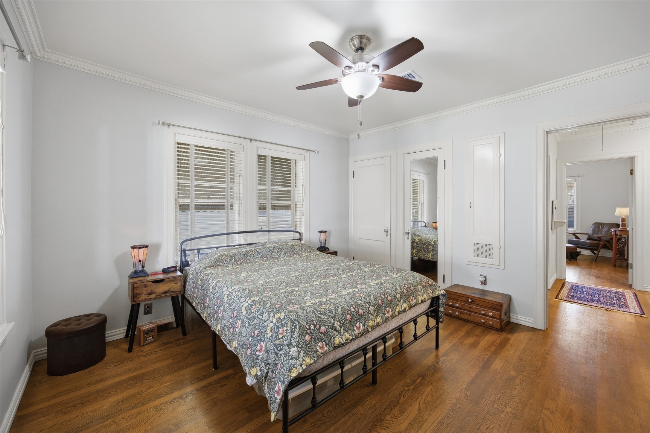 1030 East 44th Street Austin, TX 78751 - Photo 14 of 29 a bedroom with a bed and a chandelier