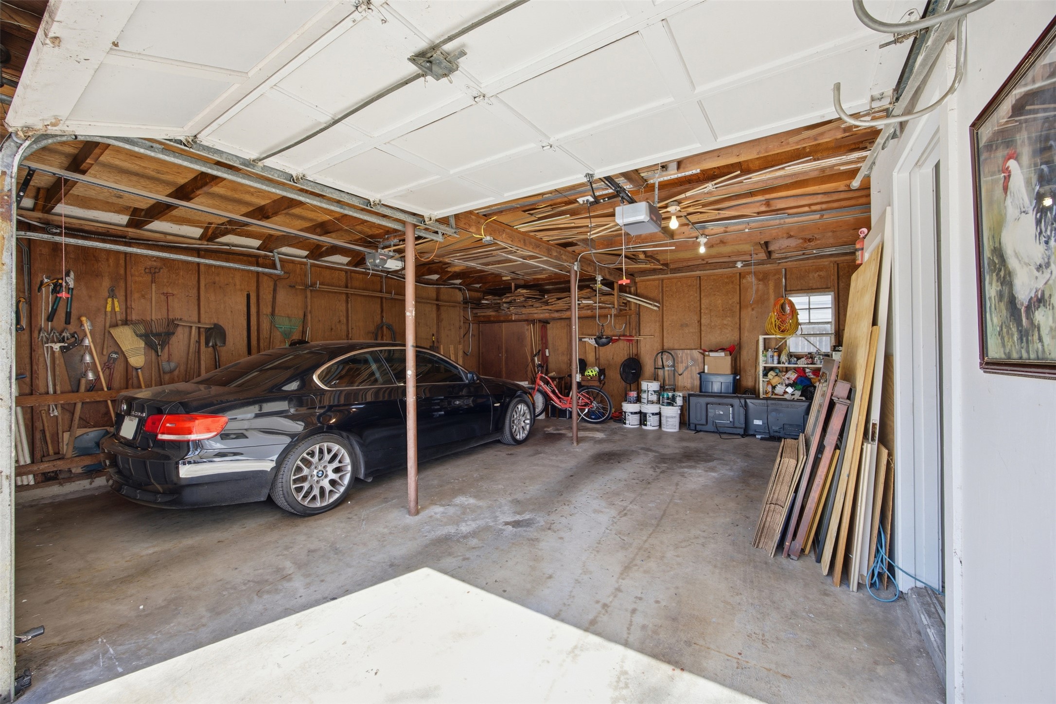 1030 East 44th Street Austin, TX 78751 - Photo 20 of 29 a view of a garage with parked cars