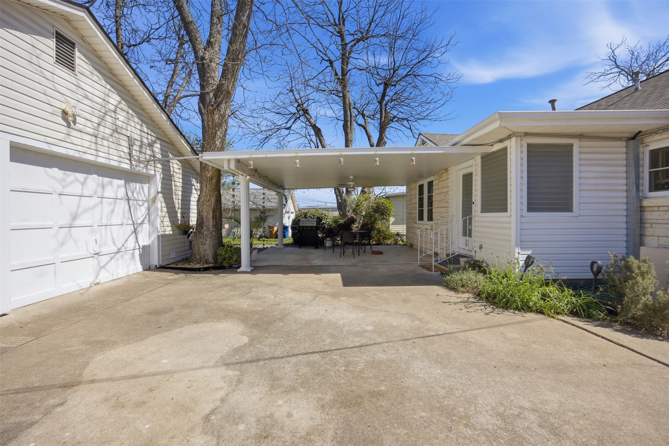 1030 East 44th Street Austin, TX 78751 - Photo 22 of 29 a view of a house with a yard and garage