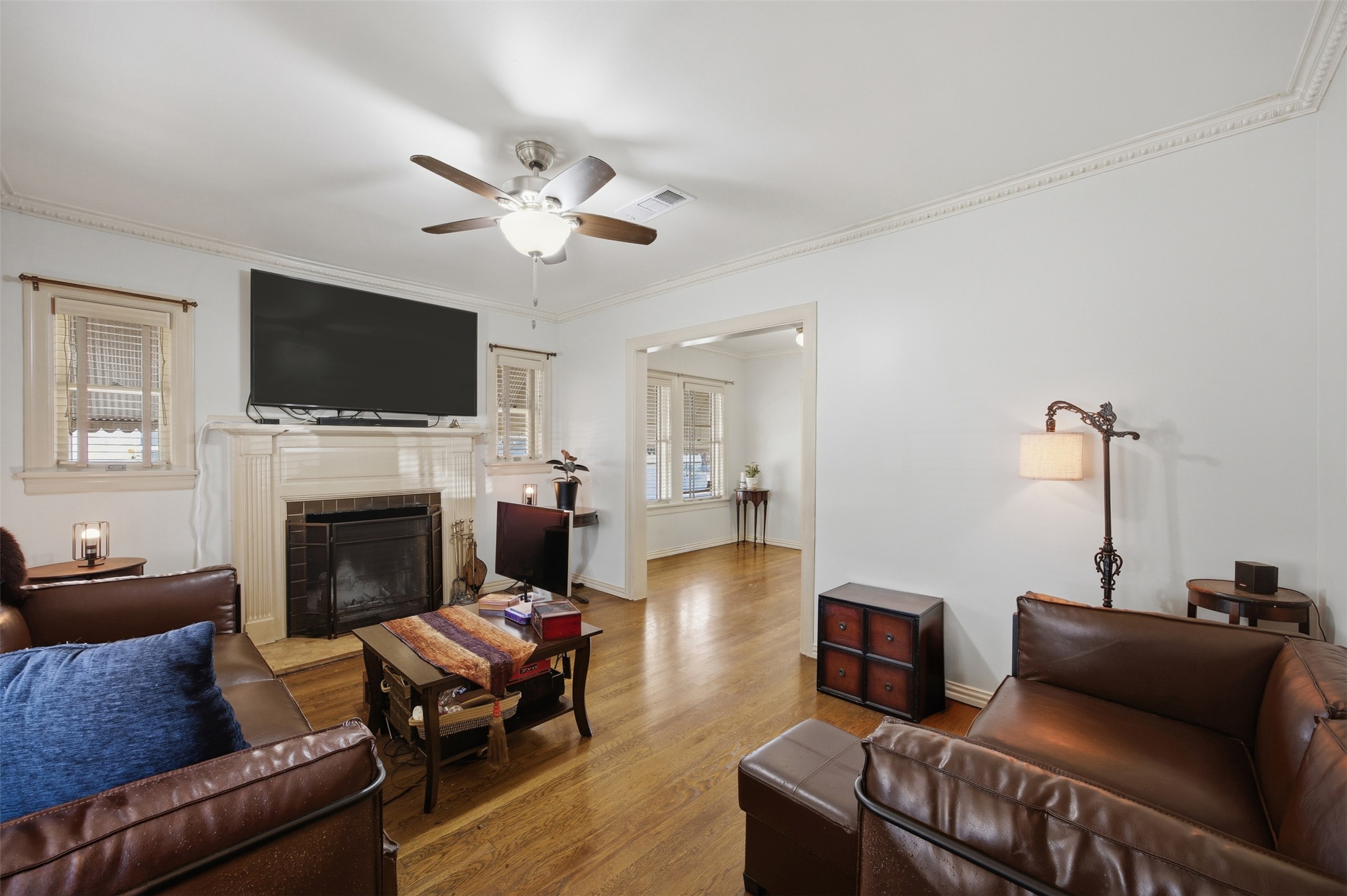 1030 East 44th Street Austin, TX 78751 - Photo 6 of 29 a living room with furniture a flat screen tv and a fireplace