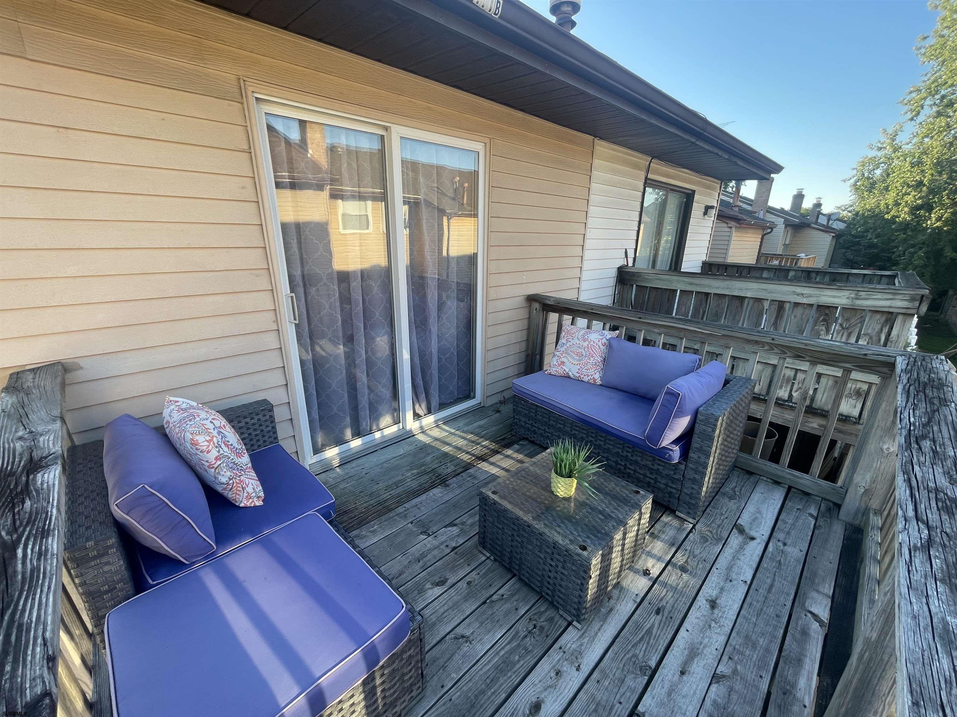 171 Via Cascata Drive, Unit B Clementon, NJ 08021 - Photo 5 of 7 a view of deck with couple of chairs